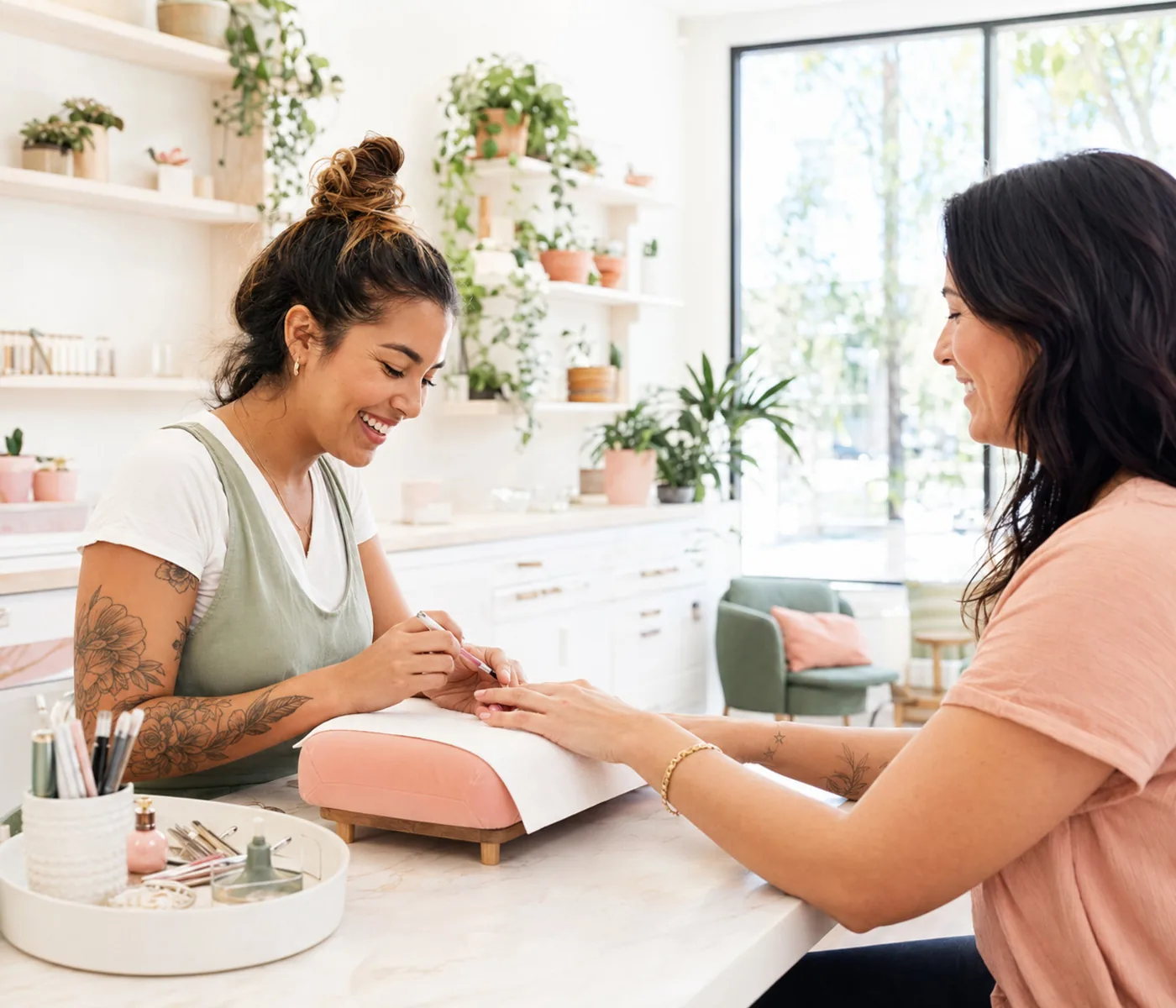 Nail artist working with a client
